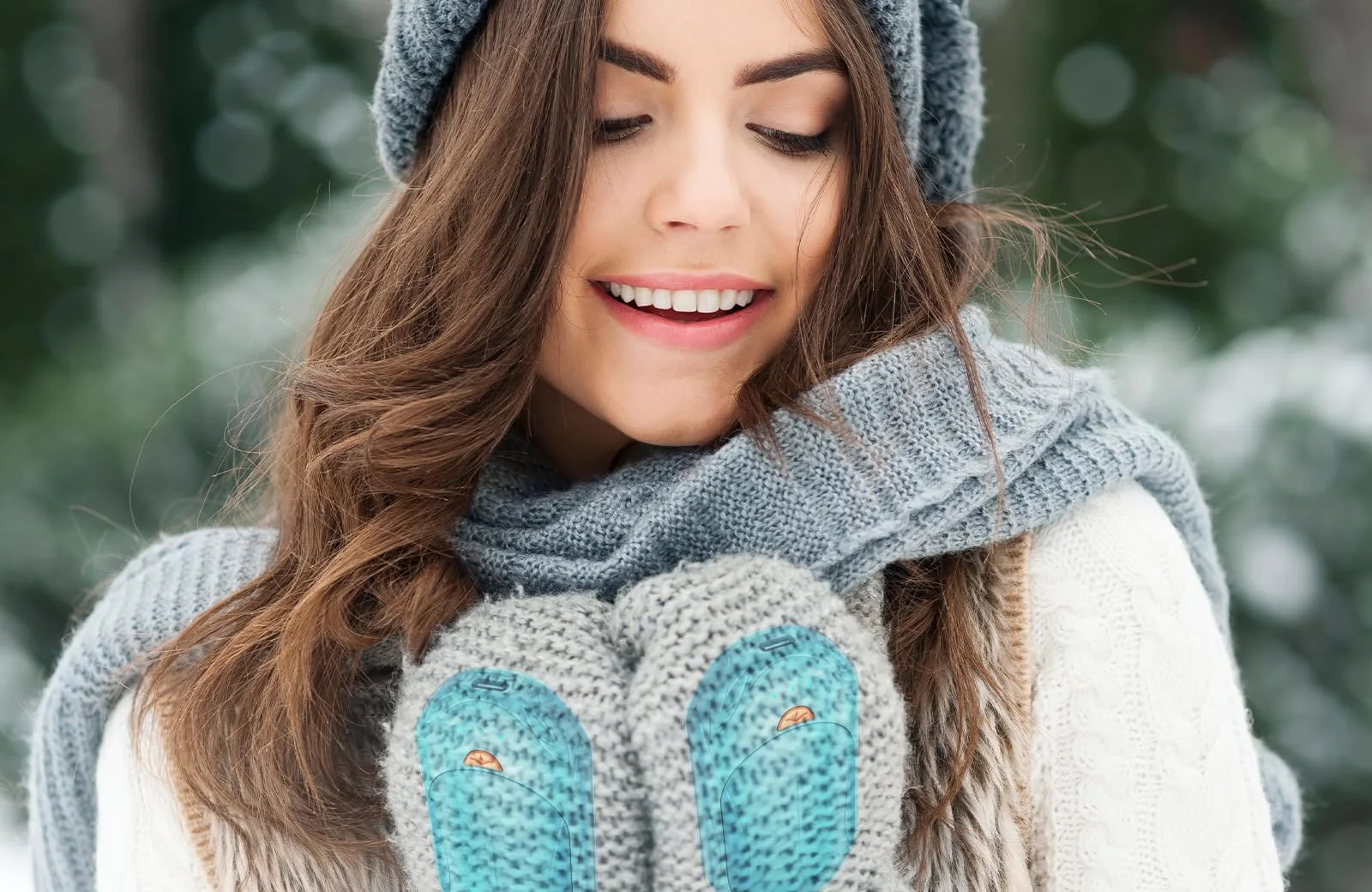 Sky Blue UNIHAND warmers glowing inside knitted mittens